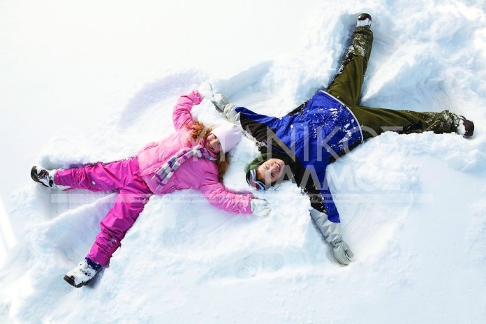 Children making snow angels