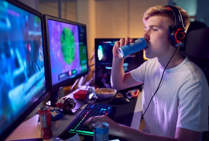 teenage,boy,drinking,caffeine,energy,drink,gaming,at,home,using teenage,boy,drinking,caffeine,energy,drink,gaming,at,home,using