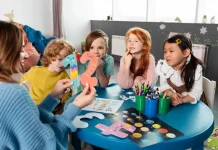 medium shot kids sitting together table 23 2149355251