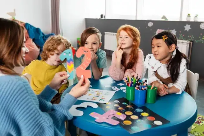 medium shot kids sitting together table 23 2149355251 medium shot kids sitting together table 23 2149355251